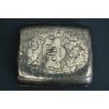A Smith & Bartlam silver cigarette case with foliate scroll engraving and bearing the initials '
