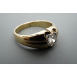 A gypsy set diamond solitaire ring, the brilliant of approximately 0.5 ct set in 9 ct gold shank,