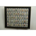 A framed set of 1930s cigarette cards "Military Uniforms of the British Empire Overseas", 42 cm x 49