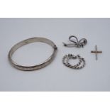 A silver hinged bangle together with a pendant cross, hoop earrings and brooch