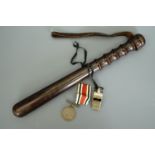 An early 20th Century Hiatt police truncheon together with an Acme Thunderer whistle bearing