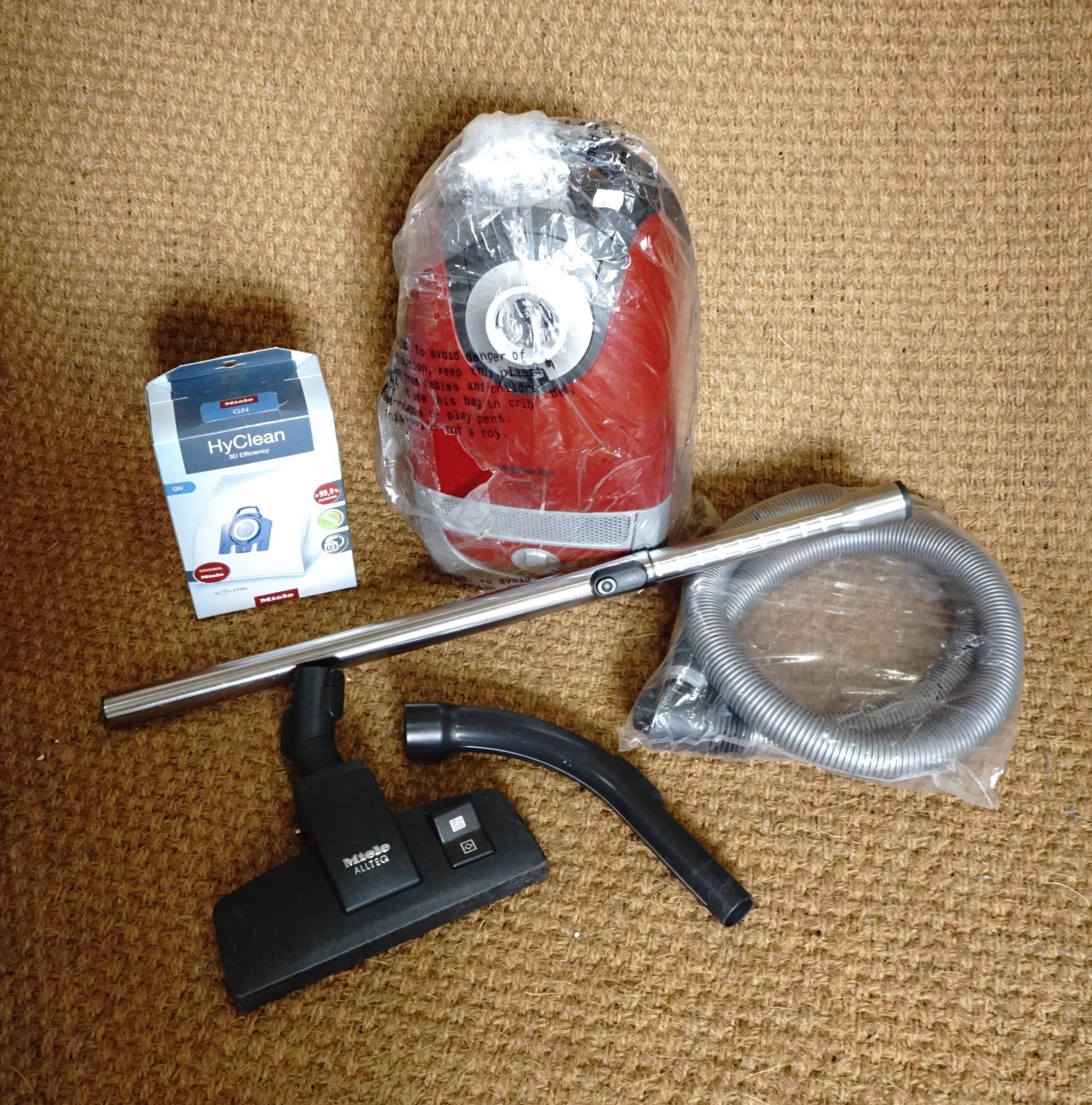 A Miele cylinder hoover and accessories