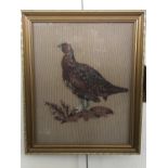 A period embroidery of a grouse atop a rocky outcrop amongst heather, in later parcel gilt frame, 44