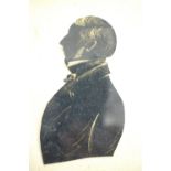 19th Century silhouettes, including a cut paper silhouette of a gentleman, and two further painted