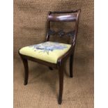 A set of six Regency mahogany sabre-legged dining chairs