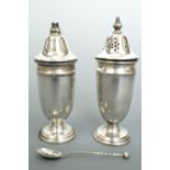 Silver salt and pepper pots together with a spoon, former 10 cm