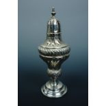 A Victorian silver pepperette, of fancy form, floral scroll chased and engraved, spirally fluted and