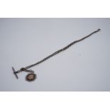 An early 20th Century silver graded curb link watch chain, with T-bar and fob, 32 cm