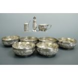 An Asian white metal pepperette and salt cellar / mustard pot, together with six electroplate
