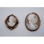 A Victorian yellow metal mounted shell cameo brooch, carved depicting the profiles of a classical