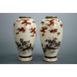 A pair of Meiji Japanese Satsuma earthenware vases, oviform and hand enamelled in depiction of