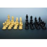 A vintage wooden chess set in a mahogany box, king 8 cm