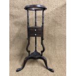 An old reproduction George III tripod wash stand