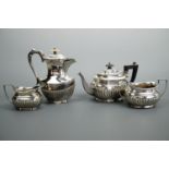 A Victorian "bachelor's" silver three-piece tea set, of Georgian gadrooned form, Pinder Brothers,