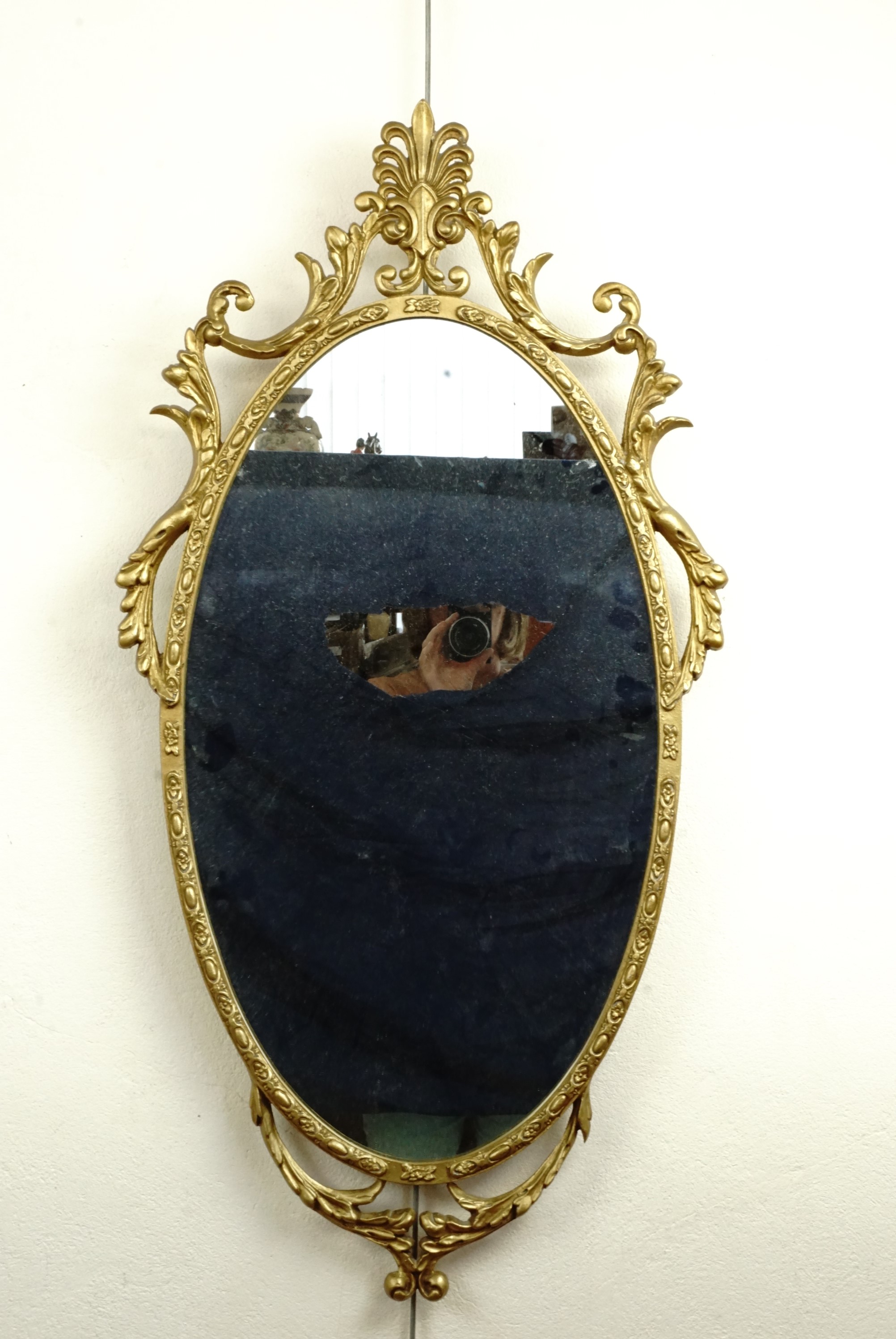 A gilt metal framed mirror, 90 cm