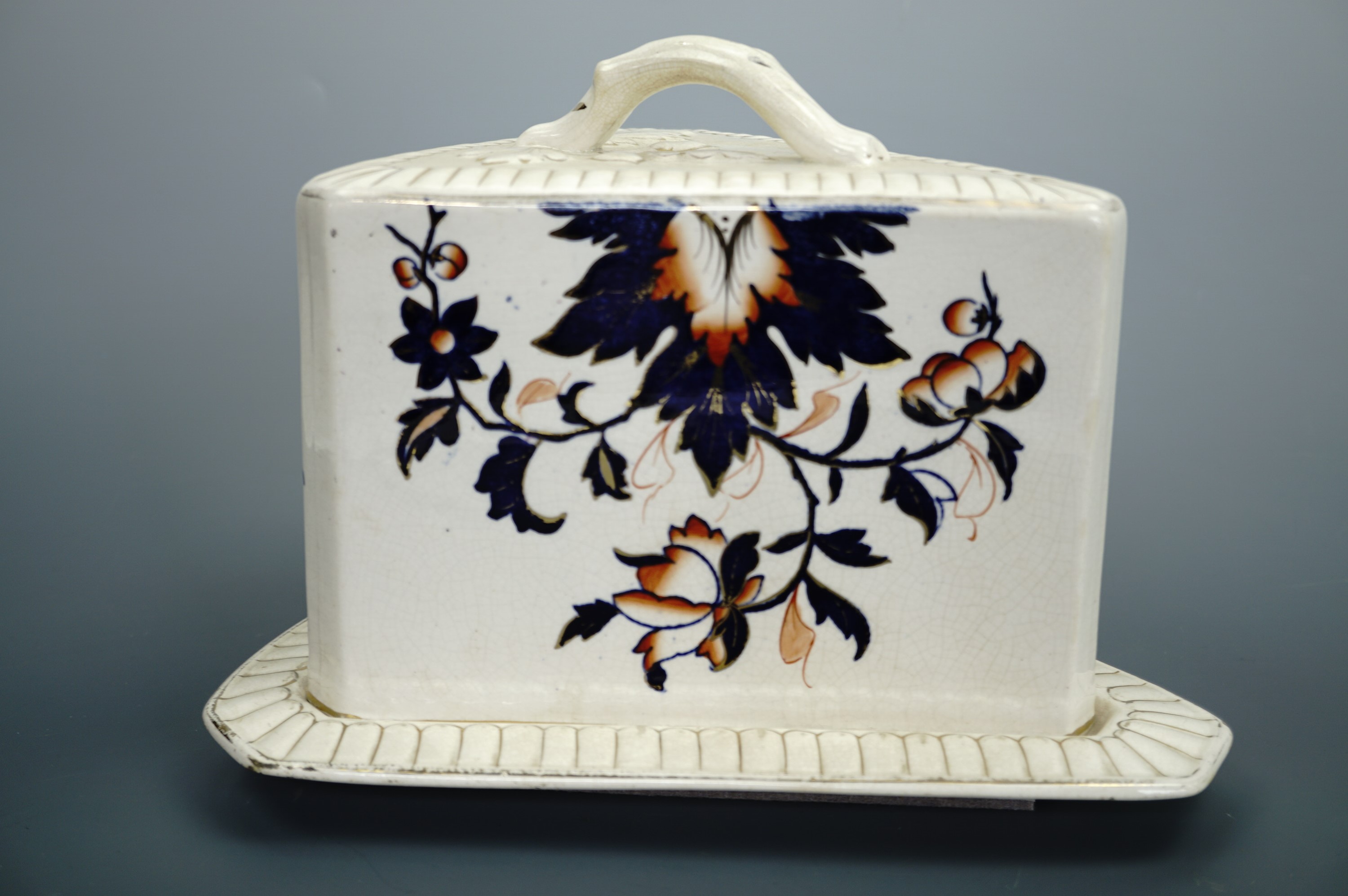 A large Victorian Imari palette earthenware cheese stand and cover