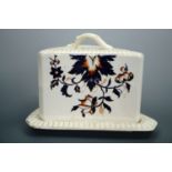 A large Victorian Imari palette earthenware cheese stand and cover