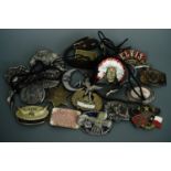 A quantity of largely US Western themed belt buckles, spurs, bolo ties etc