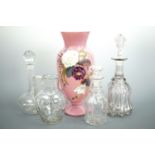 Three Victorian decanters together with an enamelled free-blown glass jug, and an enamelled pink
