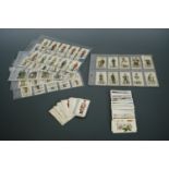 A quantity of military uniform cigarette cards