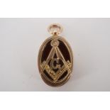 A 1920s 9 ct gold, carnelian and blood stone Masonic fob, 21 mm excluding suspender