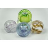 Four Caithness paperweights