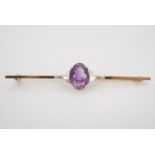 An amethyst and 9 ct gold bar brooch, circa 1930s, stone 11 mm x 8 mm, 6 cm, 3.8 g