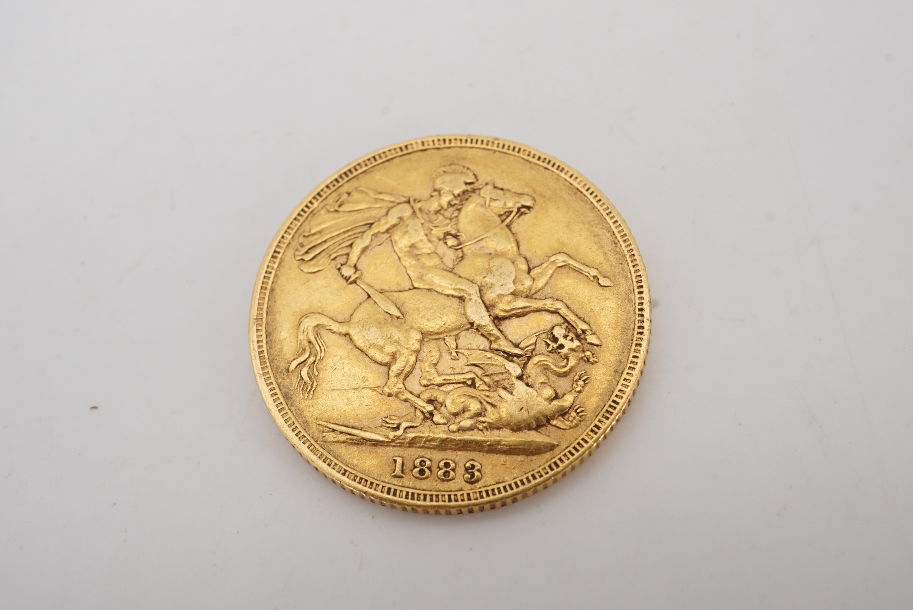 An 1883 gold Sovereign