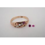 An antique ruby and white stone finger ring, the cushion-shaped face set with a diagonal band of