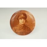 A Great War Columbian Studios of Chicago lacquer plaque depicting in sepia the bust a woman in