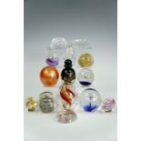 Fourteen various glass paperweights