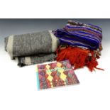 A Mexican ceremonial robe / poncho, a blanket and related book