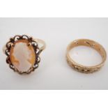 A yellow metal finger ring set with a shell cameo, together with a paste-set yellow metal band, (