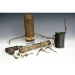 Three inert relic Great War grenades, together with caltrops and barbed wire fragments