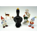 A Beswick hound, continental figurine, Noddy and Big Ears figurines and a pie funnel