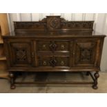 A 1920s Carolean revival oak sideboard, 52 cm x 153 cm x 119 cm