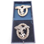 A quality cased reproduction Luftwaffe pilot observer's badge and one other badge