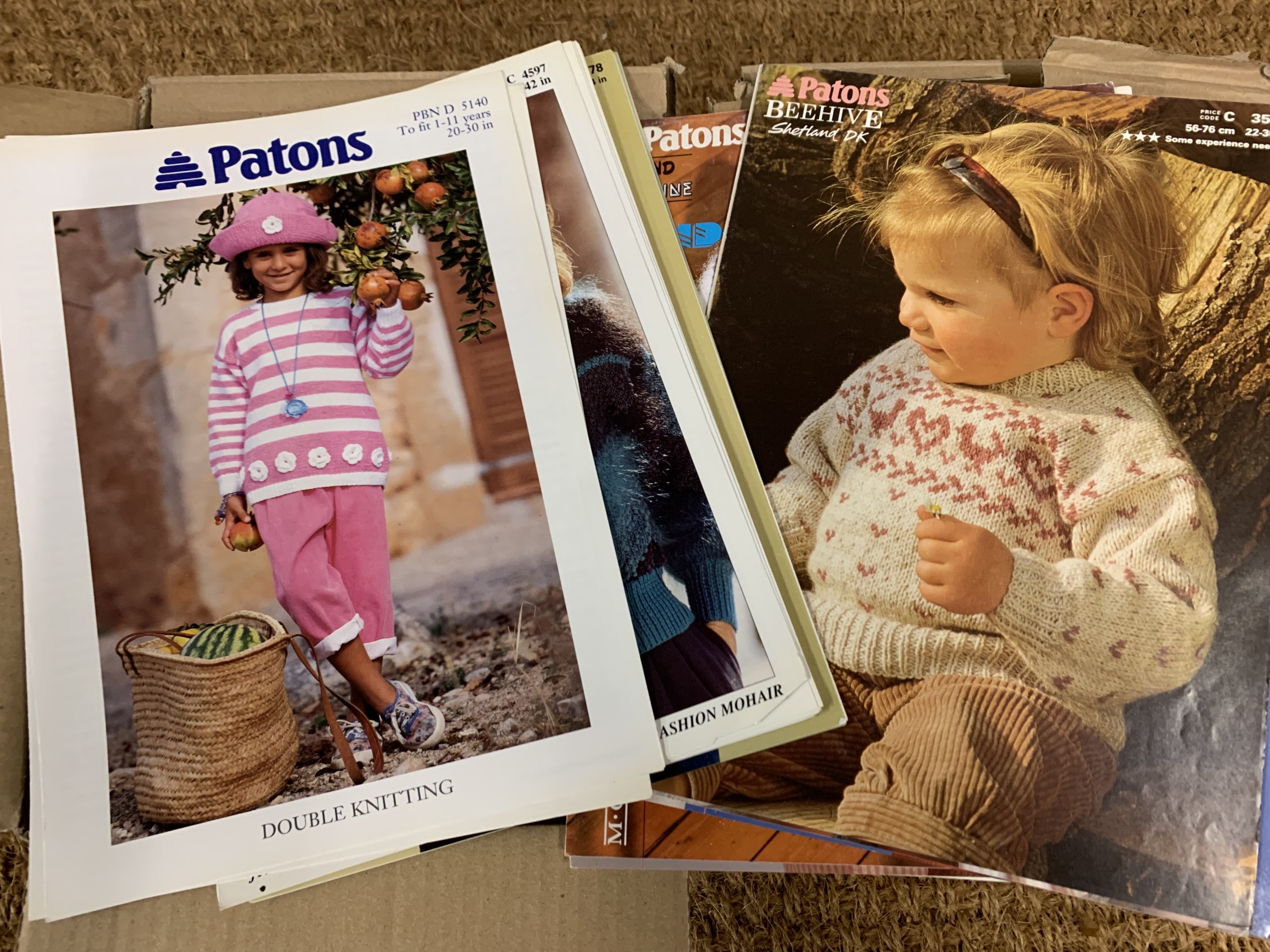 Two cartons of new old shop stock knitting patterns