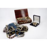 A vintage jewellery box together with a large quantity of vintage and contemporary costume jewellery