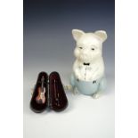 A novelty piggy bank together with a cased miniature violin, pig 16 cm