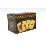 A carved and painted wooden playing cards box