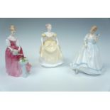 Two Royal Doulton figurines Alexandra and Paula, together with a Coalport figurine "Emily",