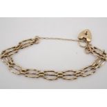 A yellow metal gate link bracelet with padlock clasp, 8.9 g