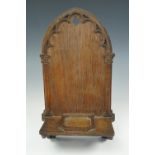 A late 19th / early 20th century small Gothic carved wooden display shelf / wall bracket, 30 cm