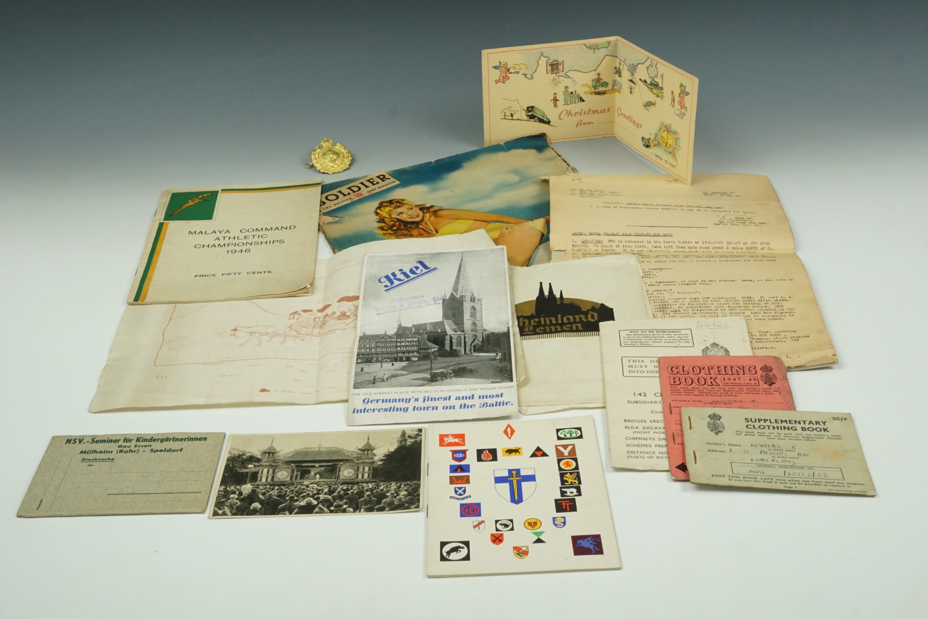 A quantity of largely Second World War military ephemera together with a Royal Engineers cap badge