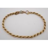 An Italian yellow metal rope link bracelet, stamped 750, 5.8 g