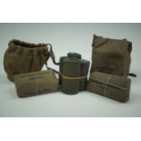 A group of Great War German field dressings, a tourniquet and fabric pouches