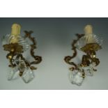 A pair of Baroque influenced brass and glass sconces, together with a Rococo example, 20 cm