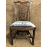 A George III provincial walnut Chippendale style dining chair