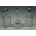 A pair of cut glass spirit decanters together with a cut glass Rodney / ship's decanter and bottle